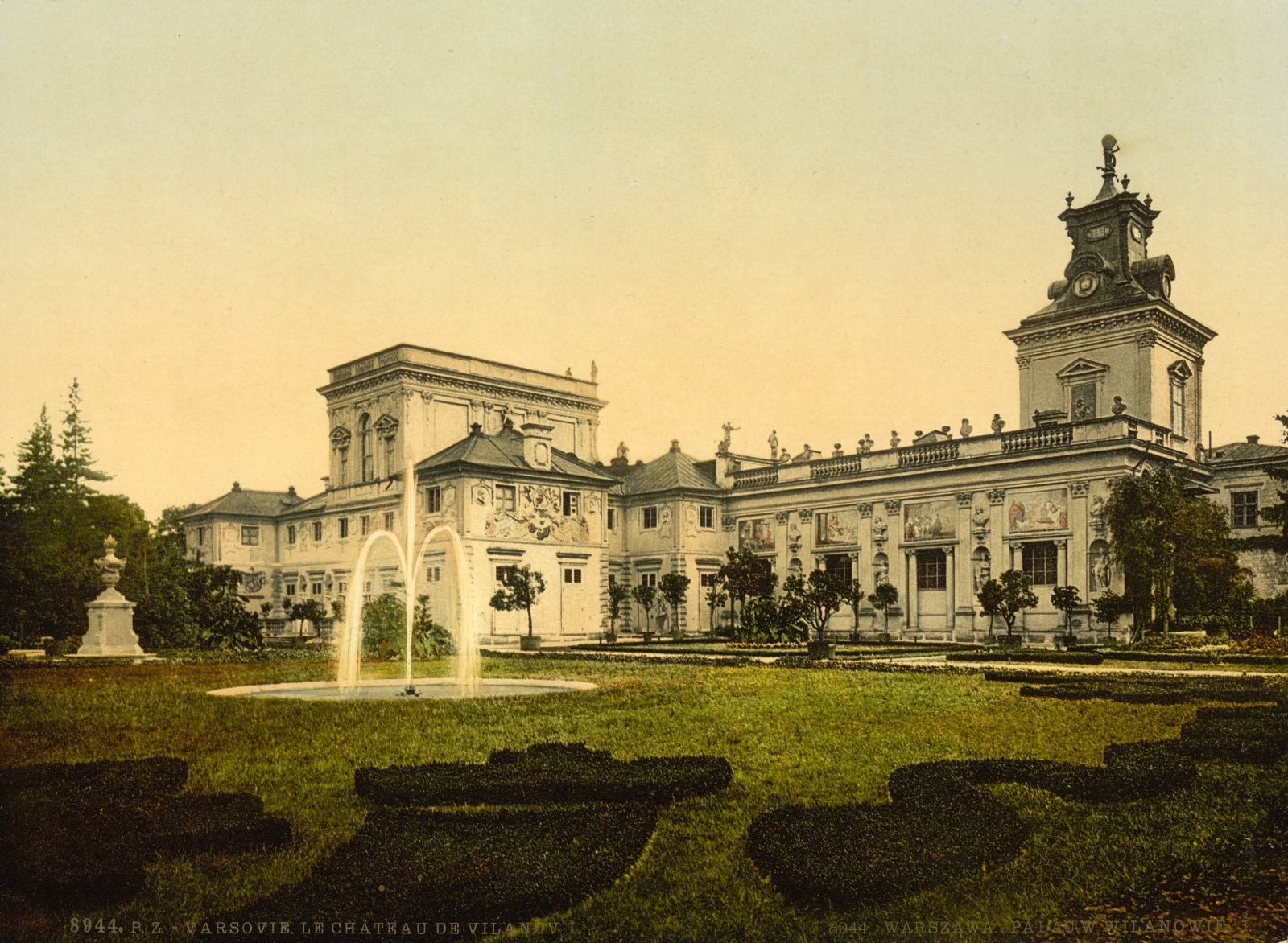 Kolorowa reprodukcja. Przedstawia Pałac Wilanowski, ogród,fontanny. 