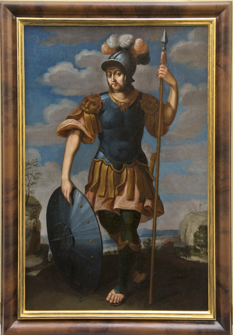 Obraz olejny przedstawia młodego mężczyznę w zbroi antycznej, z hełmem na głowie. Mężczyzna trzyma w prawej ręce tarczę. W lewej dzidę. Stoi na tle pejzażu i błękitnego nieba z chmurami. Jest to Św. Fortunat. 