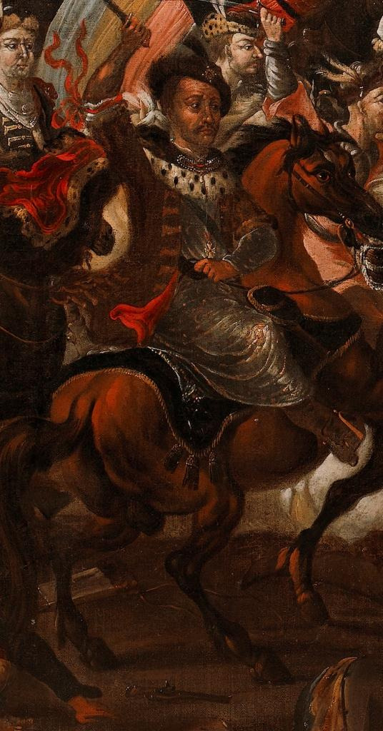 Zbliżenie na fragment obrazu olejnego „Bitwa pod Wiedniem”. Ujęcie przedstawia Jana Sobieskiego na koniu. Ubrany w strój historyczny. Podnosi prawą rękę z mieczem do góry. Za nim inni żołnierze.