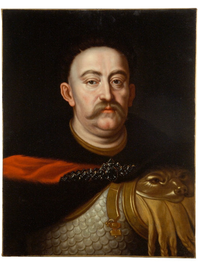 Portret Jana III Sobieskiego. Olej na płótnie. Obraz przedstawia króla namalowanego w sposób realiztyczny z dbałością o każdy, najmniejszy szczegół. Król ubrany w zbroję i dalię spiętą broszą. Tło obrazu ciemne. 