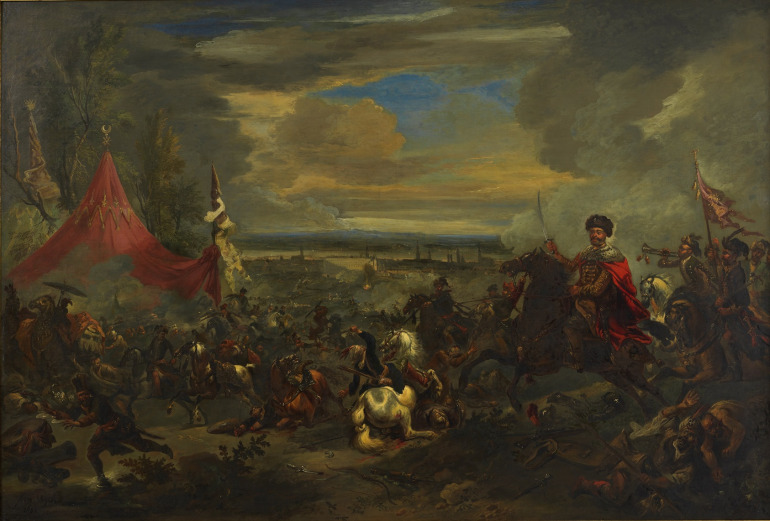 Obraz olejny na płótnie. Przedstawia odsiecz wiedeńską. Król Jan III Sobieski, na koniu i z uniesioną szablą został przedstawiony z lewej strony obrazu, po prawej stronie dominuje czerwony namiot wezyra Kara Mustafy, o który toczy się wciąż zacięta walka. Miasto zostało ledwie zaznaczone w tle, spowite dymem i otoczone wodami Dunaju.