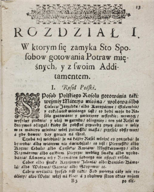 Zdjęcie przedstawia pożółkłą kartę ze starej księgi. Karta zdobiona motywem roślinnym, w całości zapisana. 